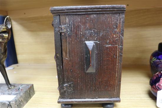 An inlaid oak spice cabinet, carved with the date, 1672 W.29cm